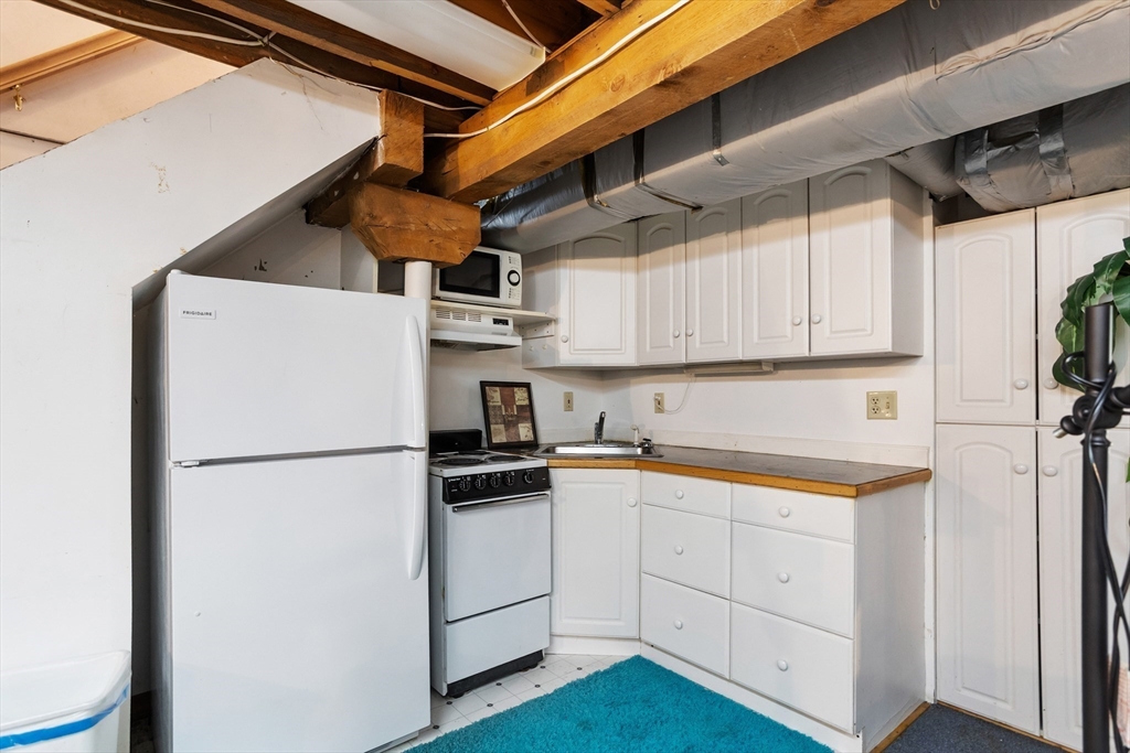 292 Berlin Road Bolton, MA 01740 - Photo 31 of 42 a utility room with cabinets washer and dryer