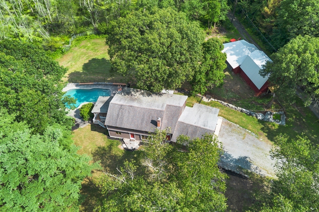 292 Berlin Road Bolton, MA 01740 - Photo 40 of 42 an aerial view of a house with a yard and a large tree