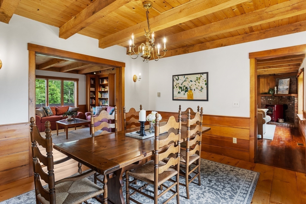292 Berlin Road Bolton, MA 01740 - Photo 8 of 42 a view of a dining room with furniture window and wooden floor