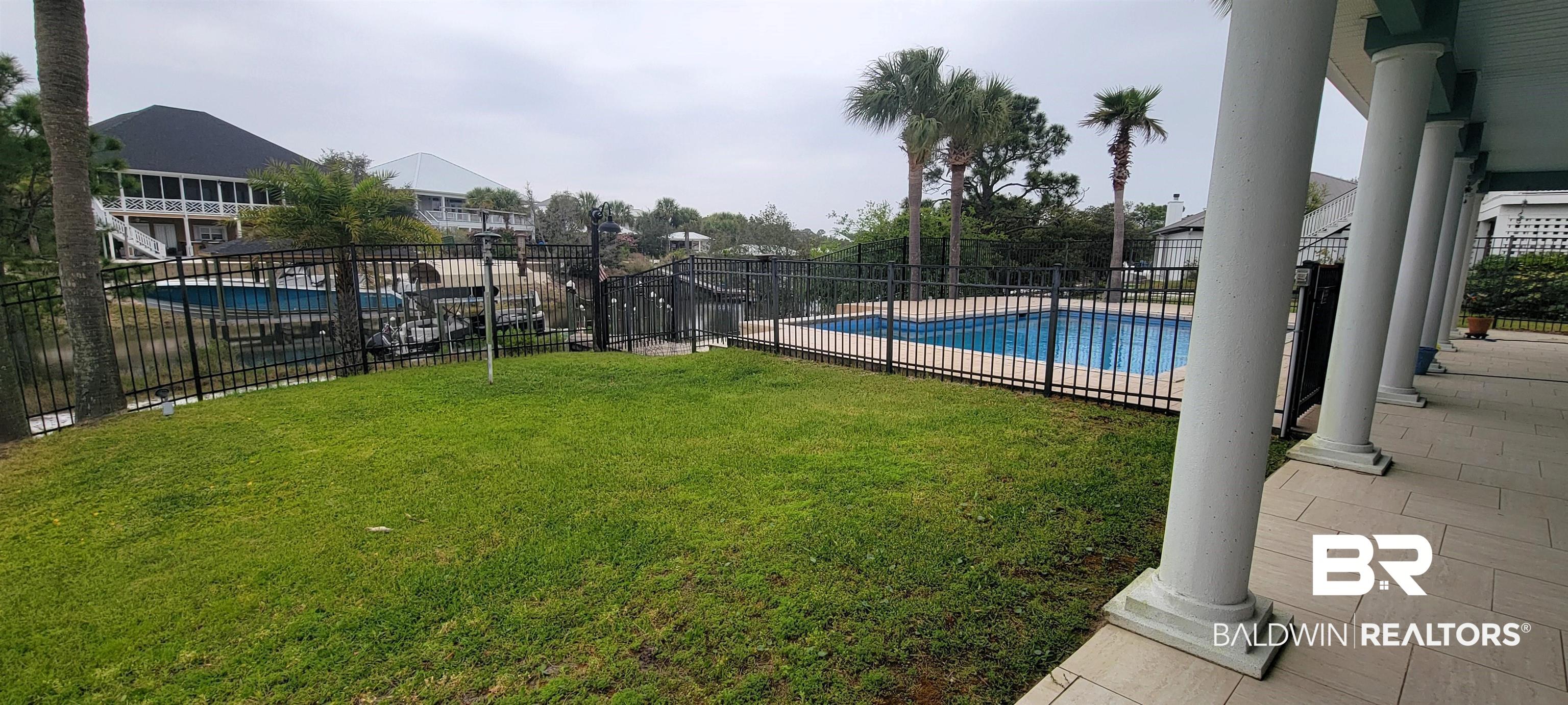 31821 River Road Orange Beach, AL 36561 - Photo 15 of 17 Pet area and pool view.