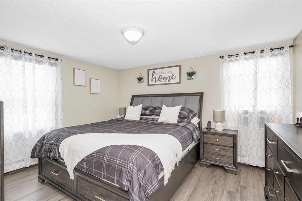 16 Old Lowell Road Westford, MA 01886 - Photo 11 of 41 a bedroom with a bed and a window