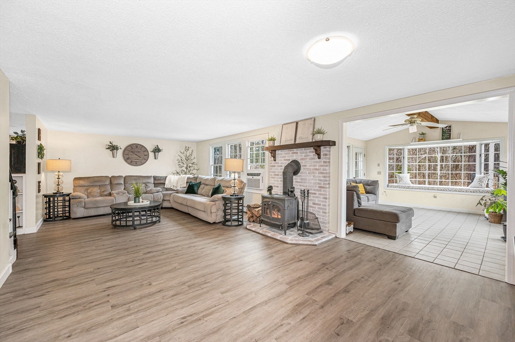 16 Old Lowell Road Westford, MA 01886 - Photo 15 of 41 a living room with furniture and a flat screen tv