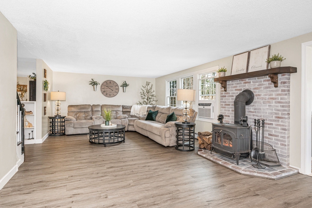 16 Old Lowell Road Westford, MA 01886 - Photo 16 of 41 a living room with furniture and a fireplace