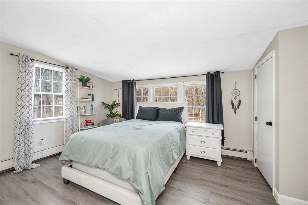 16 Old Lowell Road Westford, MA 01886 - Photo 22 of 41 a bedroom with a bed and a window