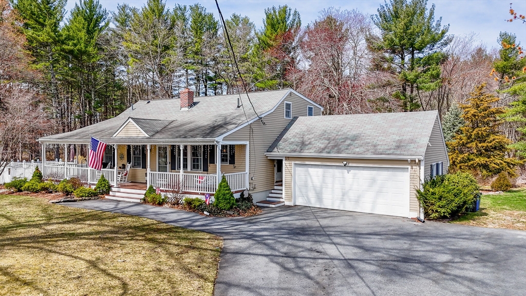 16 Old Lowell Road Westford, MA 01886 - Photo 32 of 41 a view of a house with garden and sitting area