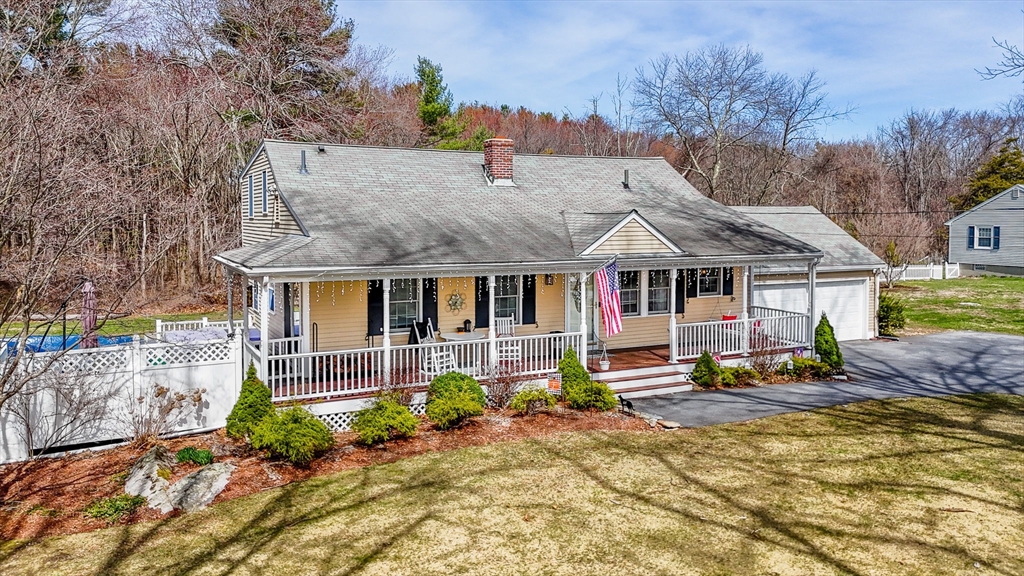 16 Old Lowell Road Westford, MA 01886 - Photo 34 of 41 a front view of house with trees in the background