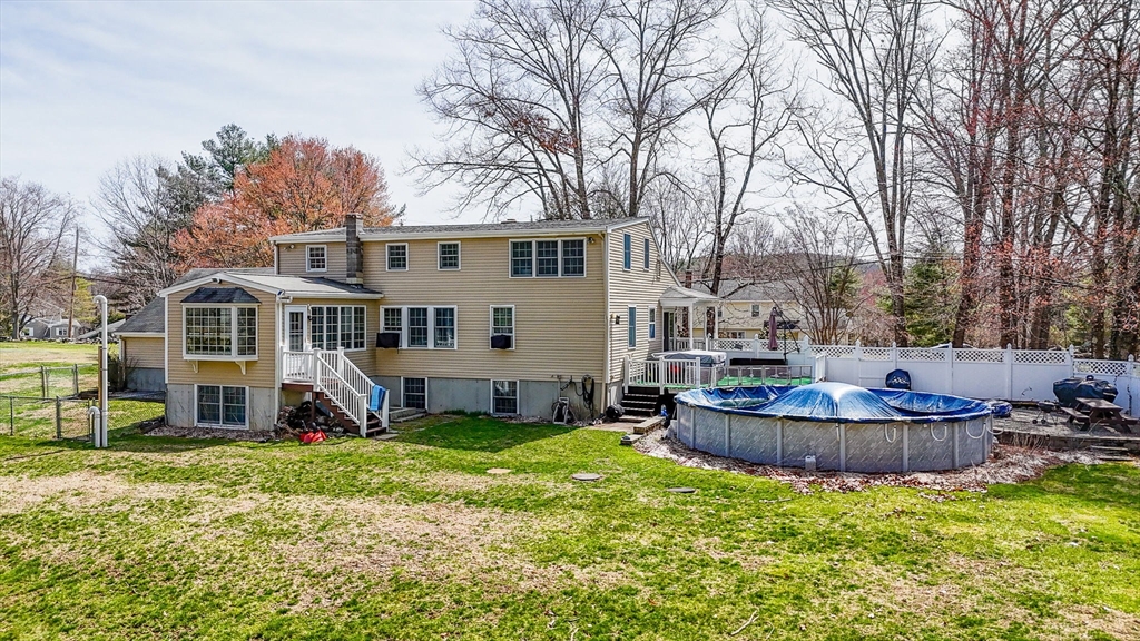 16 Old Lowell Road Westford, MA 01886 - Photo 35 of 41 a front view of a house with a garden and trees