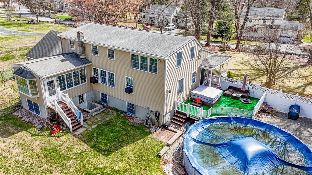 16 Old Lowell Road Westford, MA 01886 - Photo 36 of 41 an aerial view of a house with a garden and swimming pool