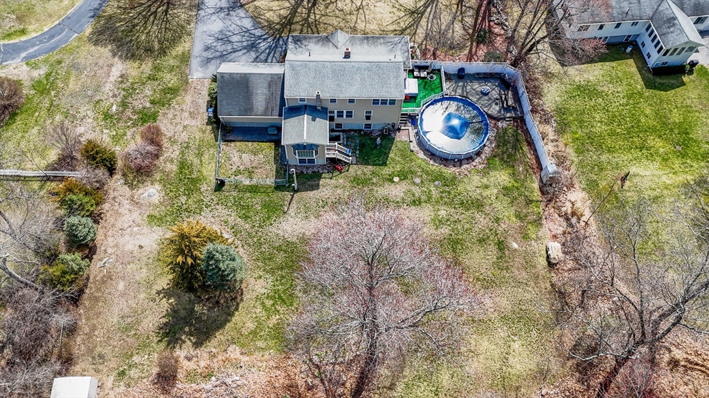 16 Old Lowell Road Westford, MA 01886 - Photo 38 of 41 a backyard of a house with a yard and outdoor seating