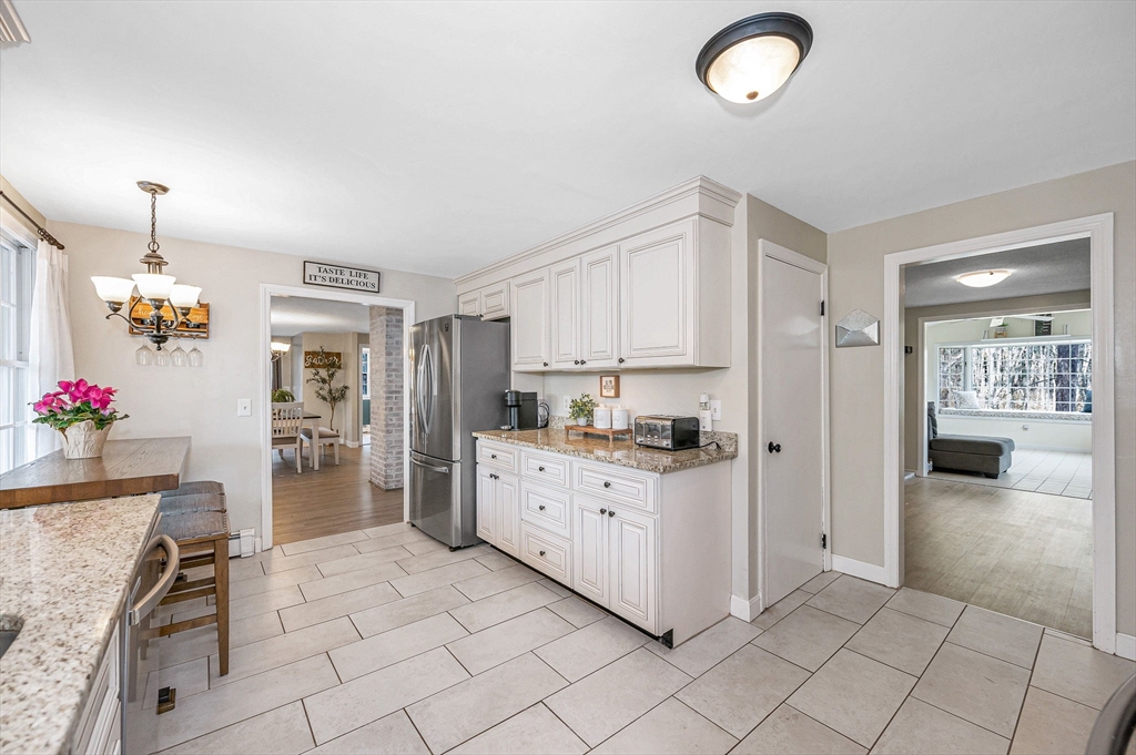 16 Old Lowell Road Westford, MA 01886 - Photo 5 of 41 a kitchen with granite countertop a sink and cabinets