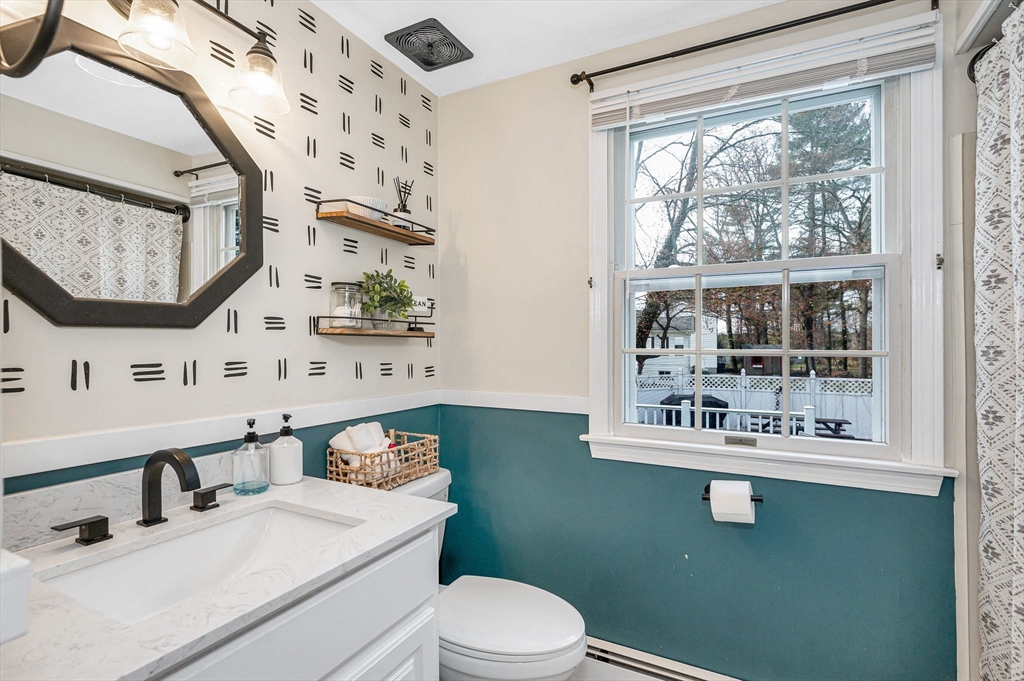 16 Old Lowell Road Westford, MA 01886 - Photo 10 of 41 a bathroom with a sink mirror toilet and next to a window
