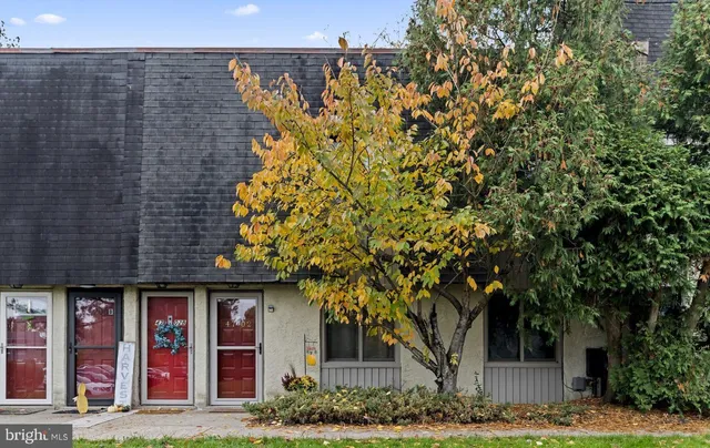 a front view of a building with garden