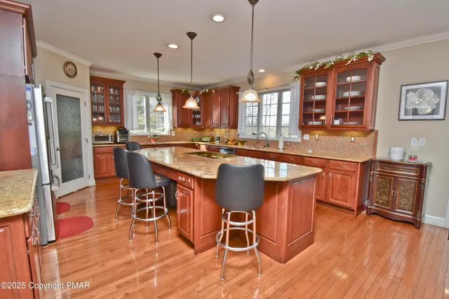 a room with pool table and flat screen tv