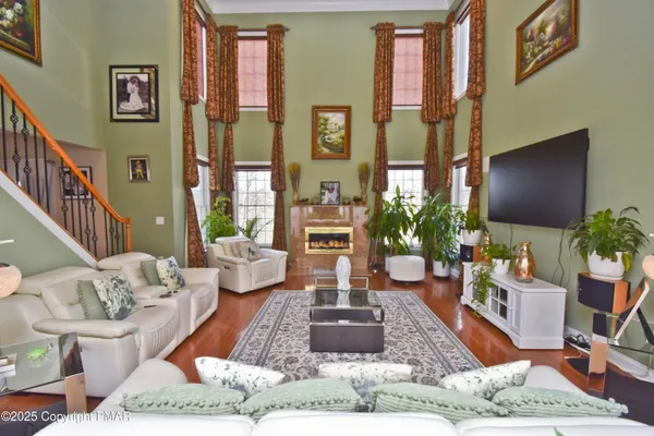 a spacious bathroom with a tub a sink and mirror
