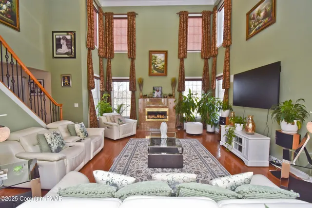 a spacious bathroom with a tub a sink and mirror
