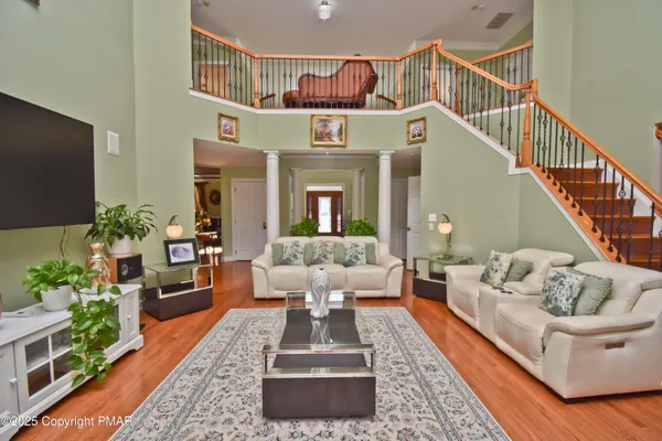 a bedroom with a bed mirror and window
