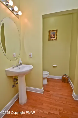 a living room with furniture rug and wooden floor
