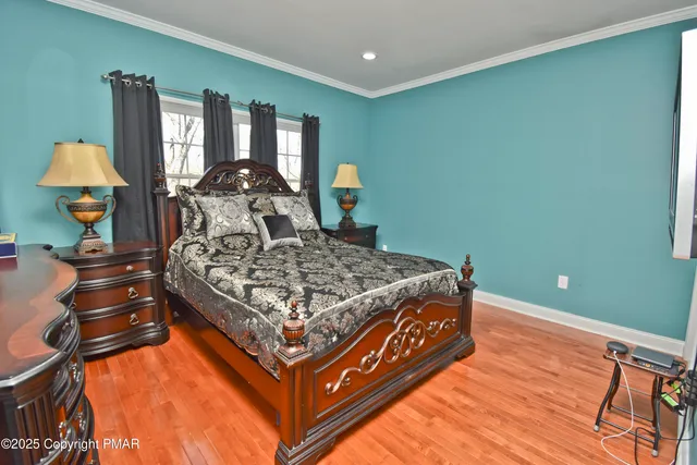 a aerial view of a house with a yard and large trees