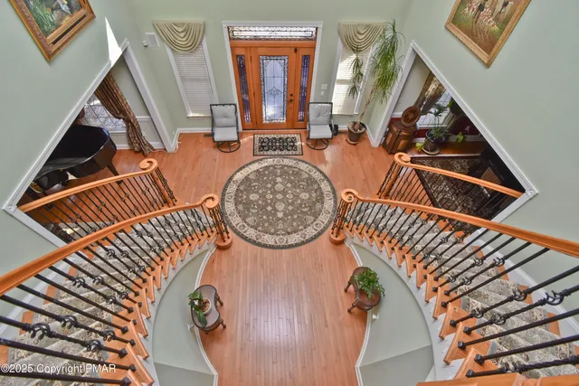 a large kitchen with stainless steel appliances granite countertop a stove a sink and a refrigerator