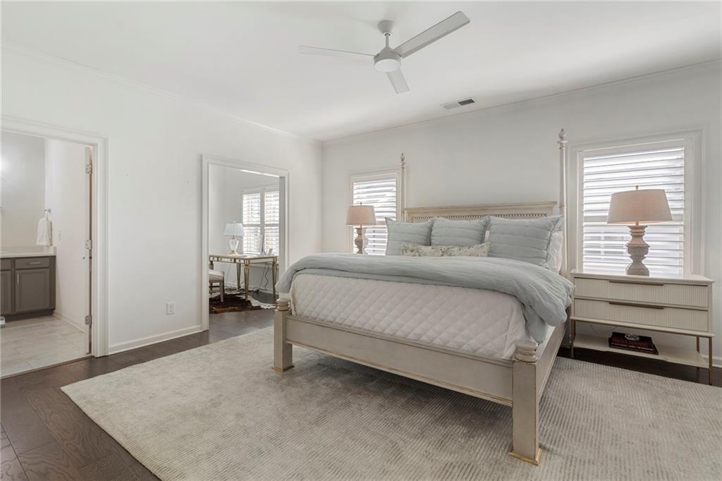 1076 Heyward Way Alpharetta, GA 30009 - Photo 18 of 57 a bedroom with a bed and a view mirror