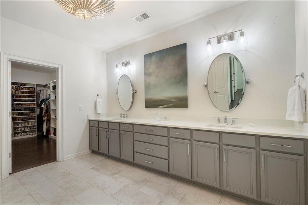 1076 Heyward Way Alpharetta, GA 30009 - Photo 21 of 57 a bathroom with a double vanity sink and a mirror