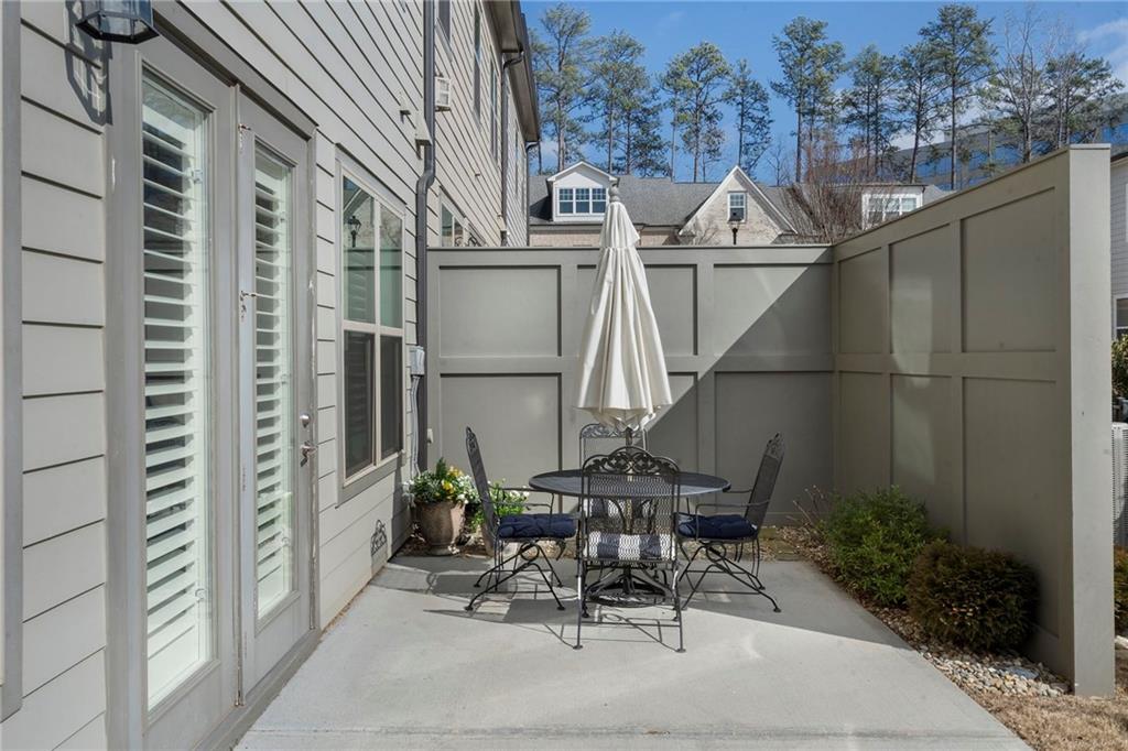 1076 Heyward Way Alpharetta, GA 30009 - Photo 27 of 57 a view of a patio with chair and table