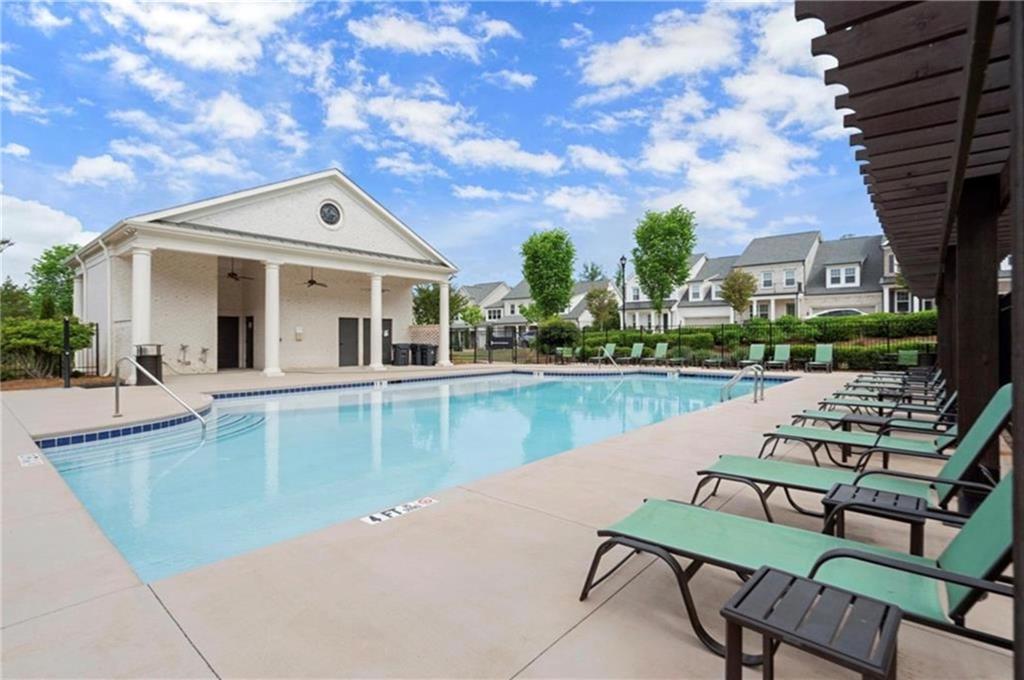1076 Heyward Way Alpharetta, GA 30009 - Photo 33 of 57 a view of house with yard and outdoor seating