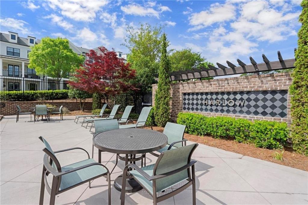 1076 Heyward Way Alpharetta, GA 30009 - Photo 35 of 57 a view of a chairs and table in the patio