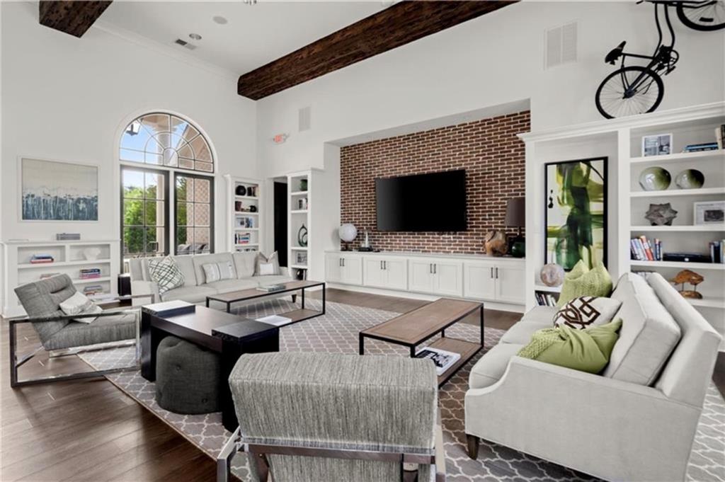 1076 Heyward Way Alpharetta, GA 30009 - Photo 41 of 57 a living room with furniture and a flat screen tv