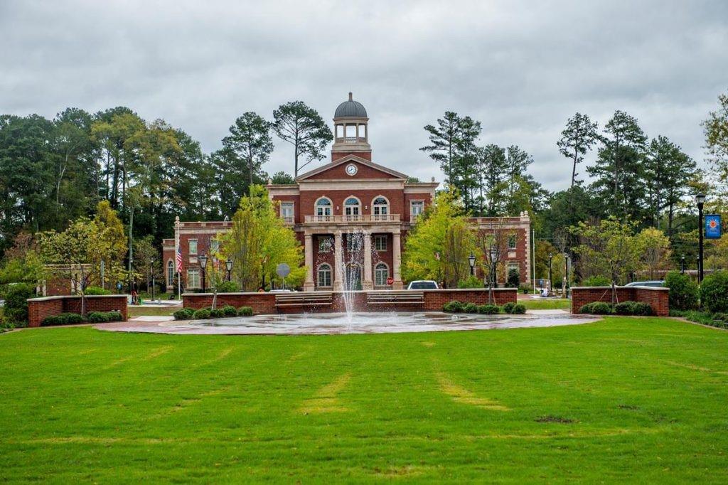 1076 Heyward Way Alpharetta, GA 30009 - Photo 51 of 57 a front view of a house with garden and trees