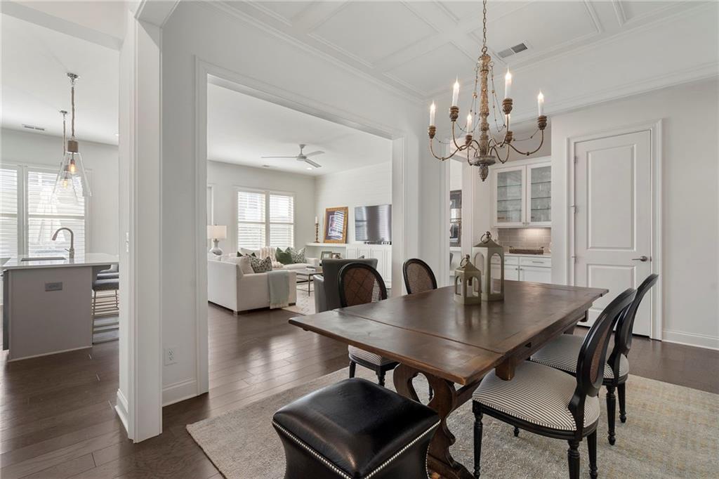 1076 Heyward Way Alpharetta, GA 30009 - Photo 7 of 57 a view of a dining room with furniture and wooden floor