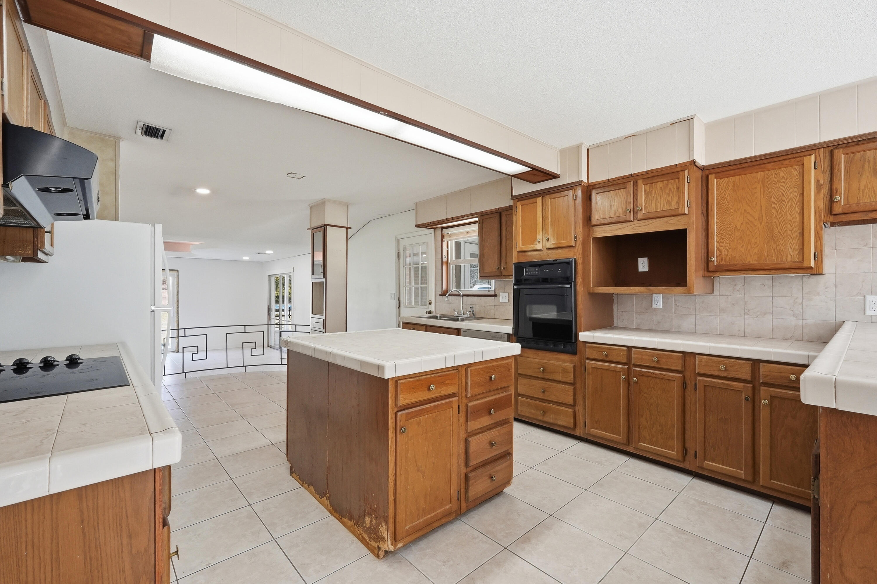 15 Maple Avenue Shalimar, FL 32579 - Photo 13 of 45 a kitchen with a stove a refrigerator and a sink