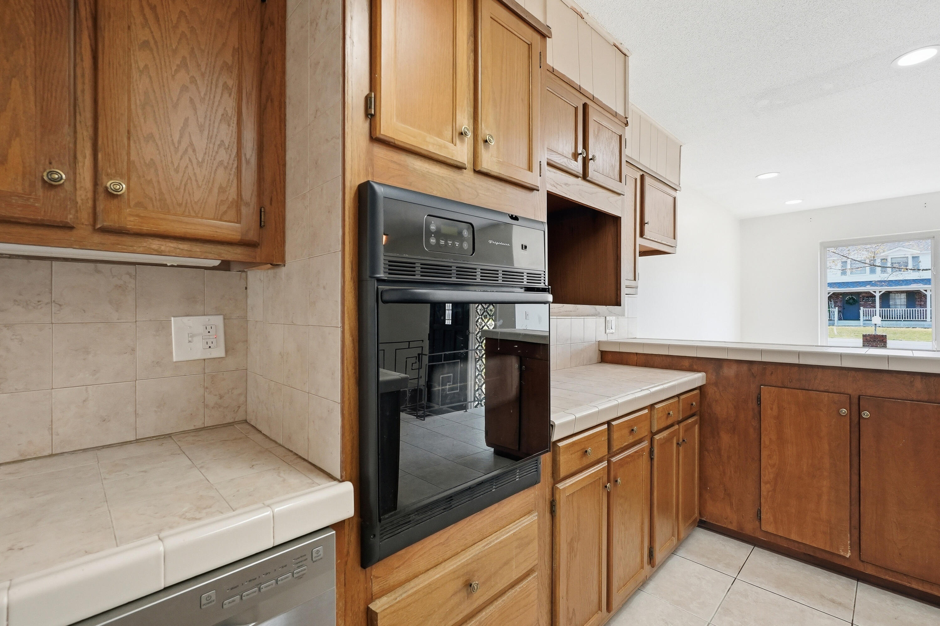 15 Maple Avenue Shalimar, FL 32579 - Photo 15 of 45 a kitchen with stainless steel appliances granite countertop a refrigerator and a sink
