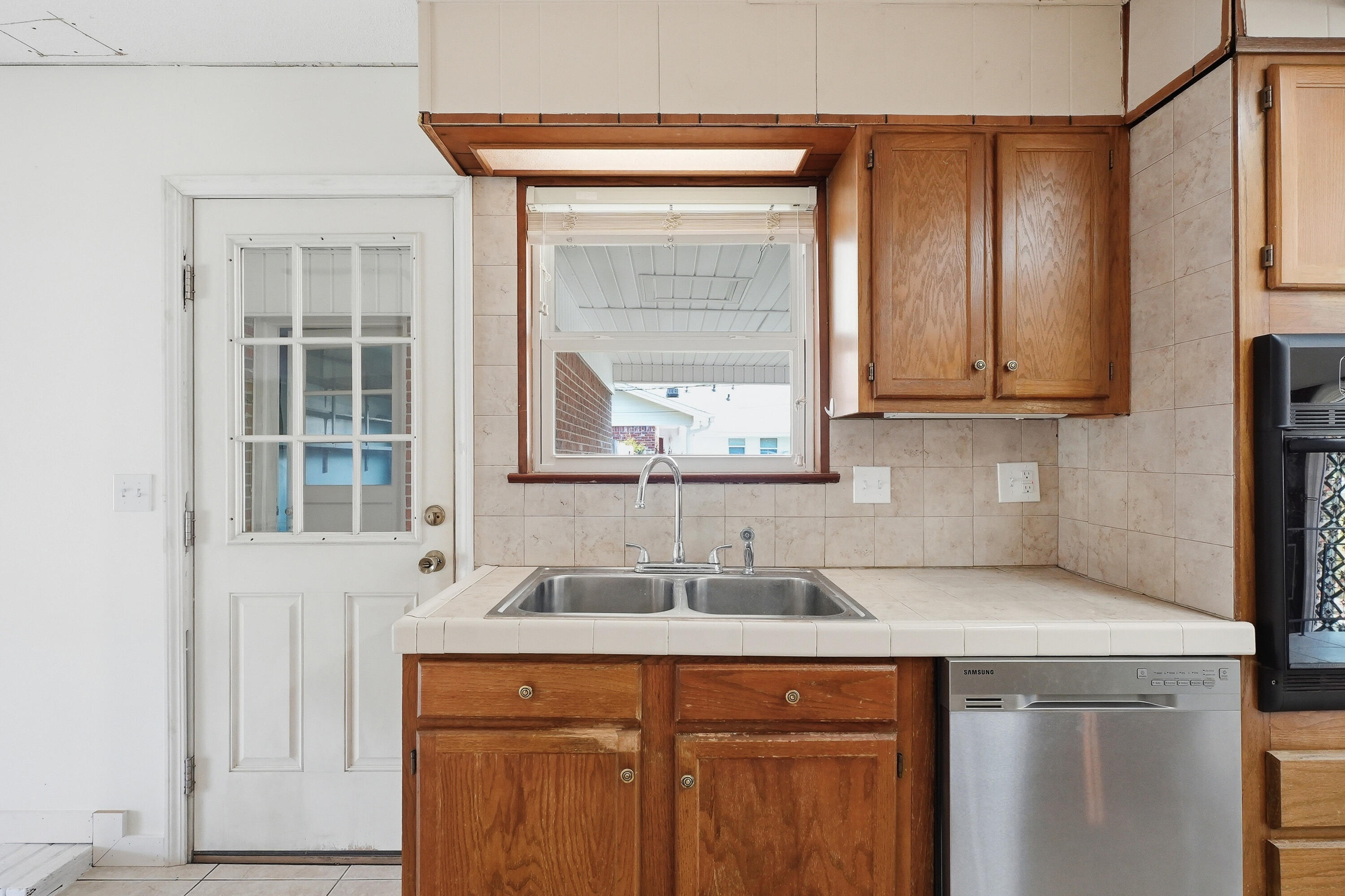 15 Maple Avenue Shalimar, FL 32579 - Photo 17 of 45 a kitchen with stainless steel appliances granite countertop a sink and a window