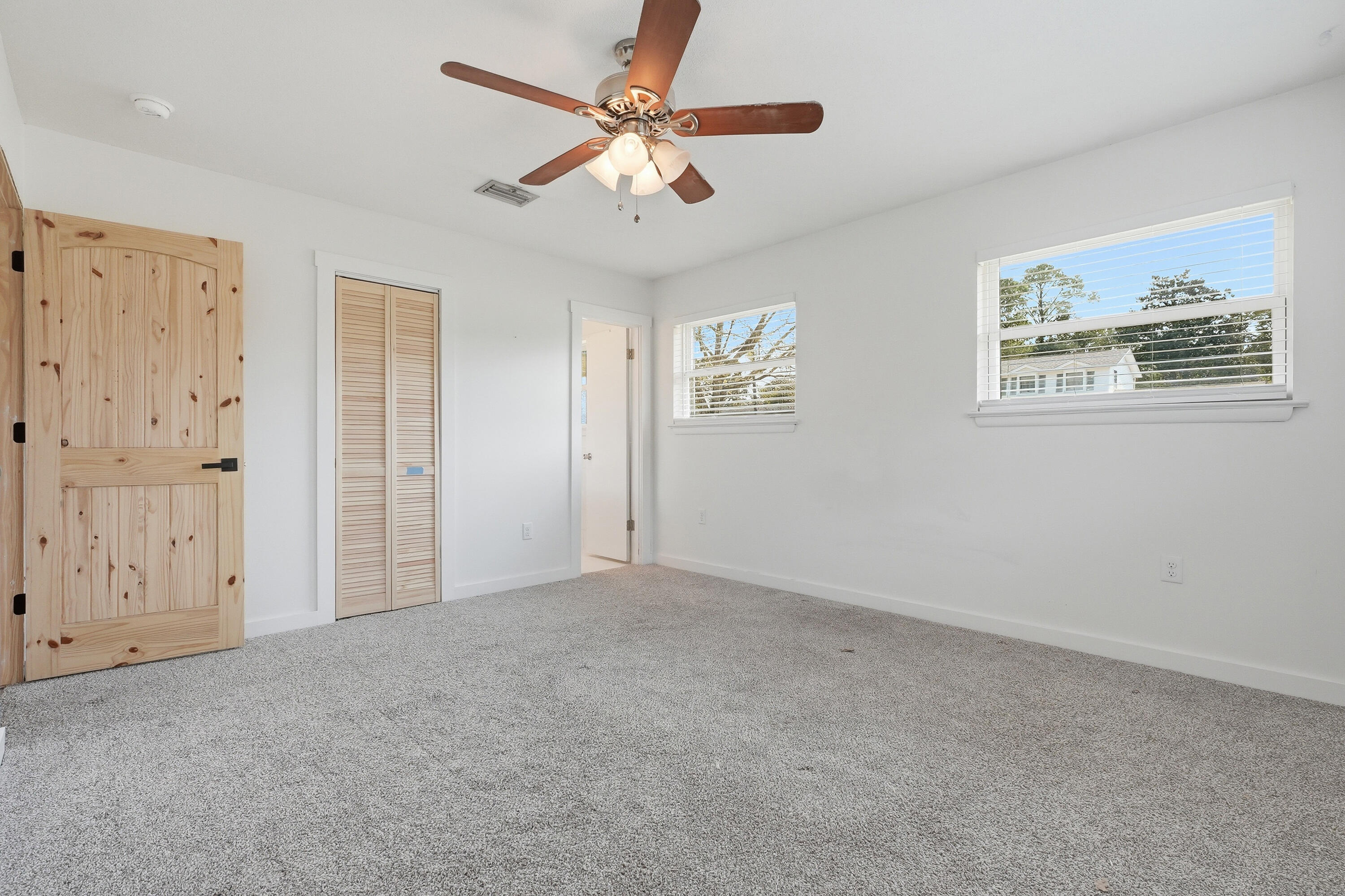15 Maple Avenue Shalimar, FL 32579 - Photo 18 of 45 an empty room with windows and fan