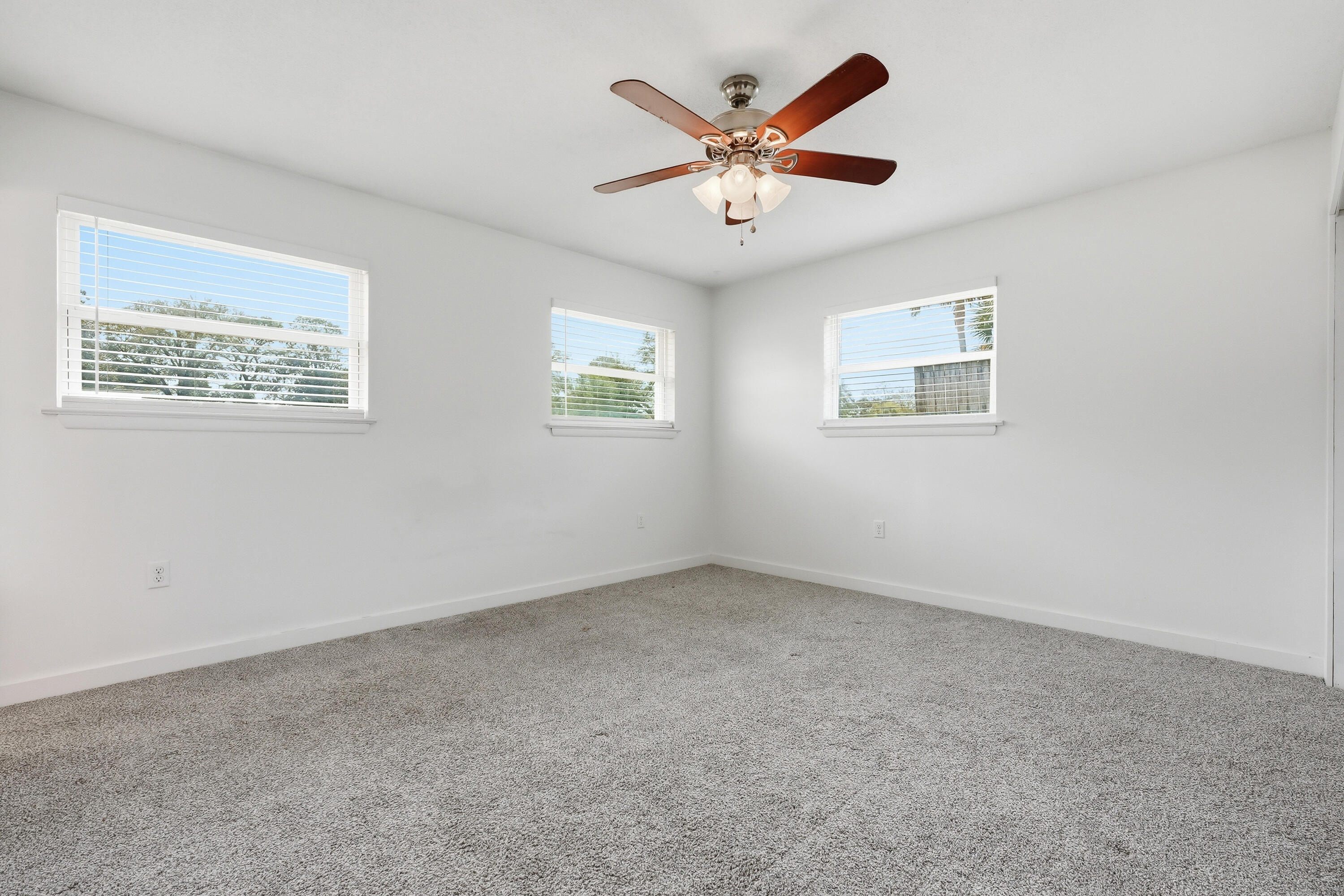 15 Maple Avenue Shalimar, FL 32579 - Photo 19 of 45 a view of a big room with wooden floor and windows