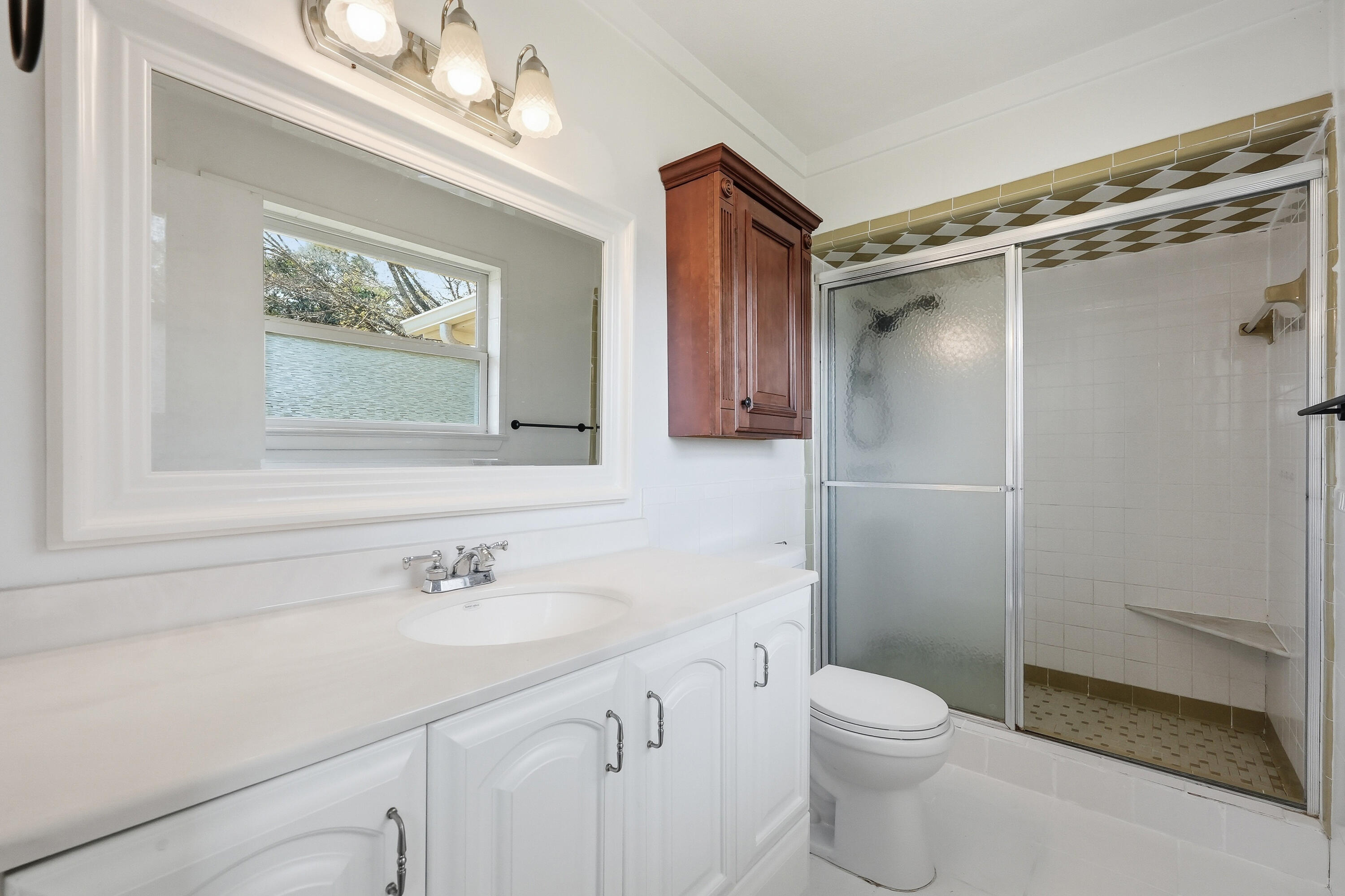 15 Maple Avenue Shalimar, FL 32579 - Photo 21 of 45 a bathroom with a shower sink vanity mirror and toilet