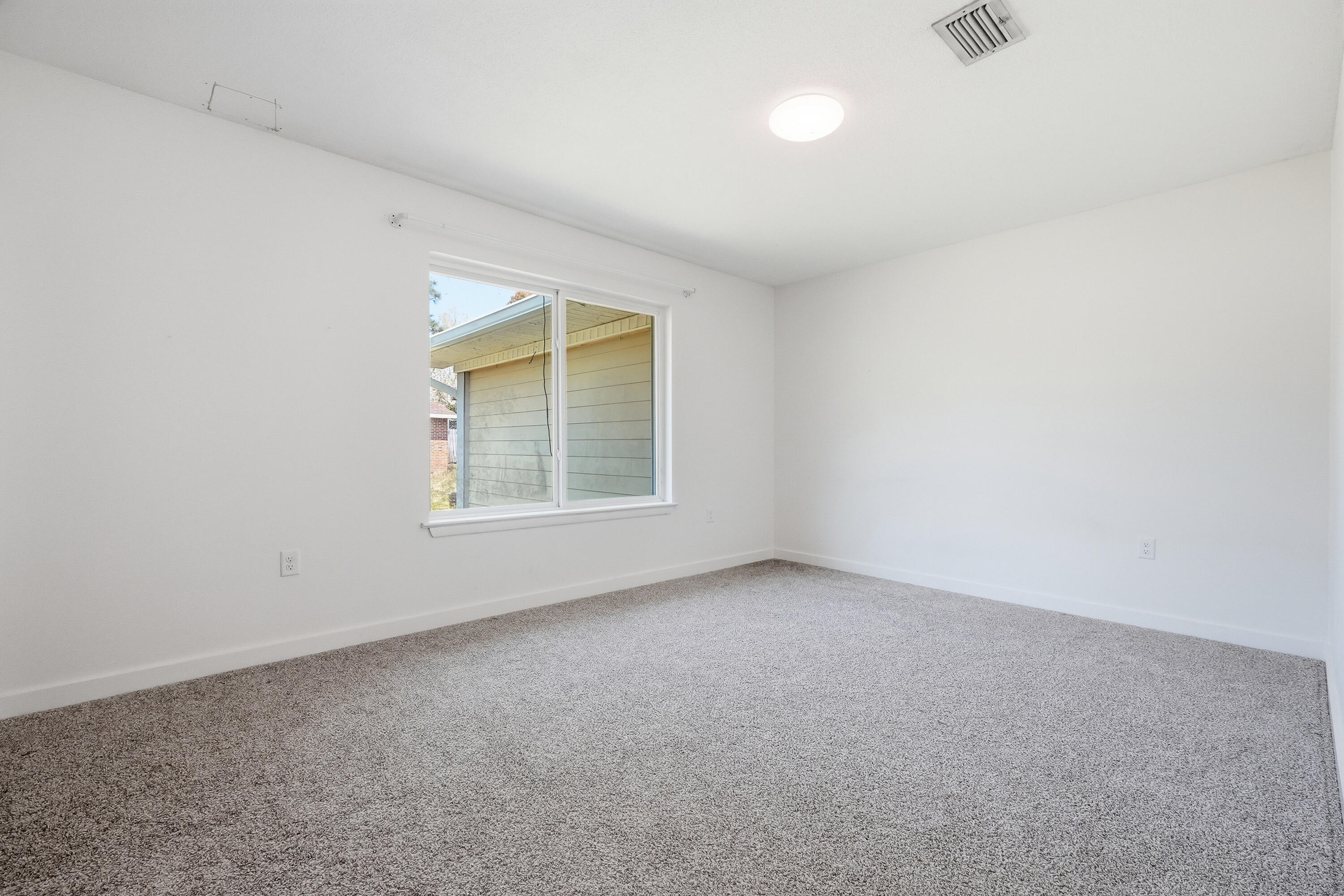 15 Maple Avenue Shalimar, FL 32579 - Photo 24 of 45 an empty room with a window