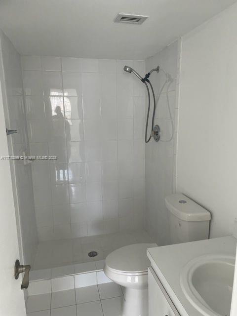 Fountainebleau Miami, FL 33172 - Photo 16 of 18 a bathroom with a shower a toilet and sink