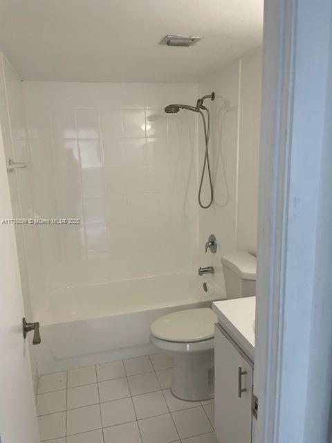 Fountainebleau Miami, FL 33172 - Photo 9 of 18 a bathroom with a granite countertop toilet a sink and shower