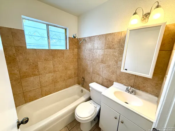 a bathroom with a sink a toilet and a bathtub