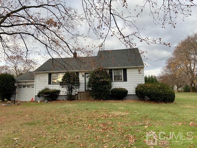 1789 Amwell Road Somerset, NJ 08873 - Photo 1 of 4 a front view of a house with a yard and a tree