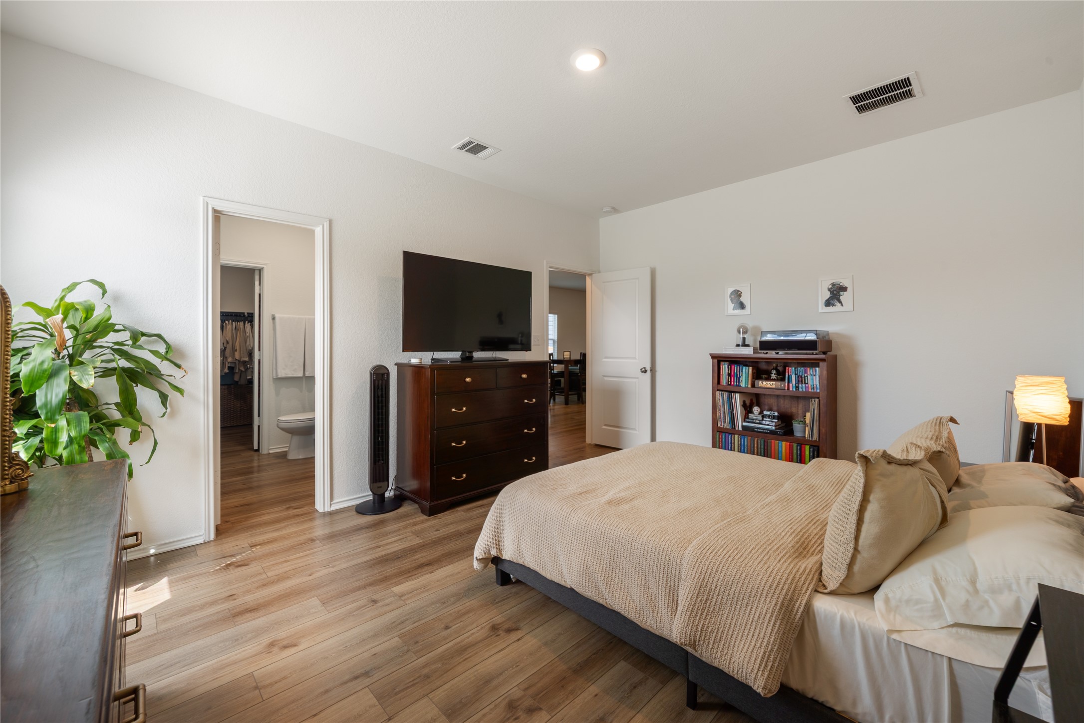 14404 Berning Road Manor, TX 78653 - Photo 17 of 38 Natural wood-look flooring sets a warm and inviting tone in this private bedroom retreat.