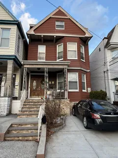 a front view of a house with parking space