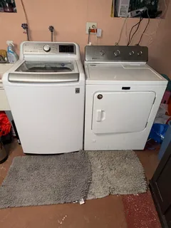 a utility room with washer and dryer
