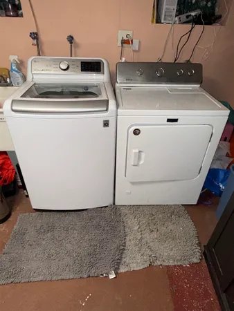 a utility room with washer and dryer