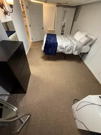 a living room with furniture and a floor to ceiling window