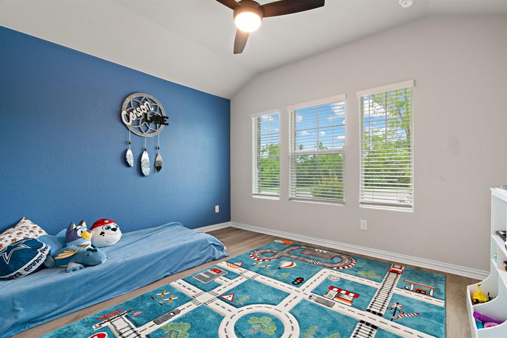 3112 Kingsgarden Road Denton, TX 76207 - Photo 19 of 38 Room featuring vaulted ceilings with a ceiling fan