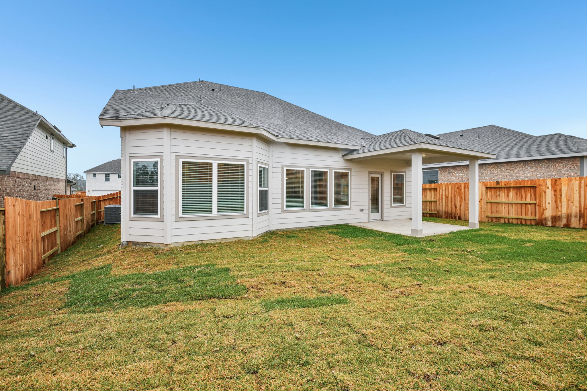 224 Raine Manor Montgomery, TX 77316 - Photo 48 of 50 a front view of a house with a garden