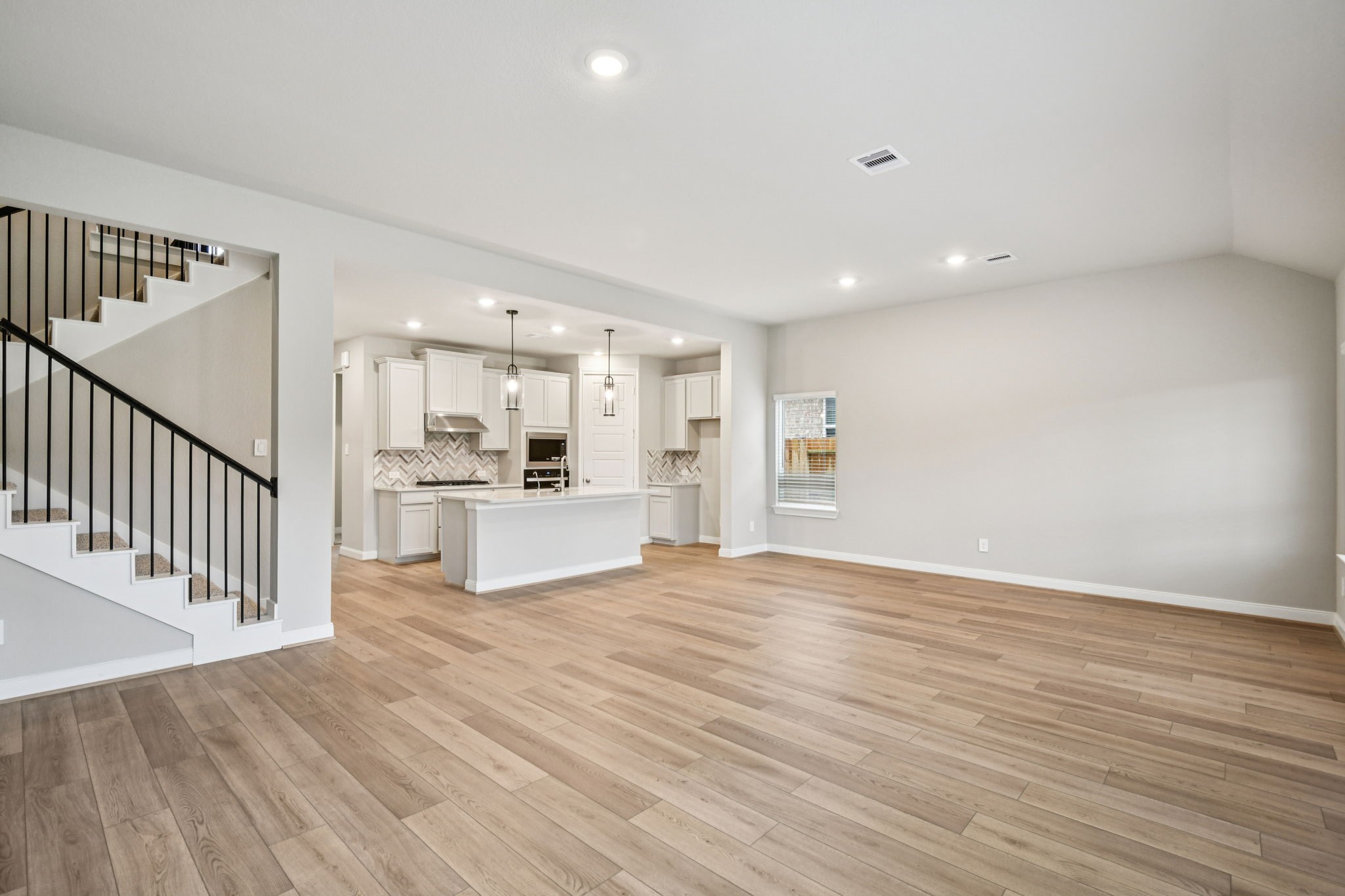 224 Raine Manor Montgomery, TX 77316 - Photo 10 of 50 a view of a kitchen with wooden floor and a sink
